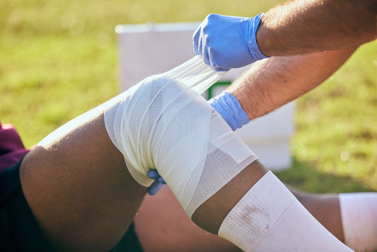 rugby sports injury and knee bandaged 