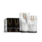 A lineup of U Perform branded supplements, including two black boxes and one sachet of "active collagen," a white pouch of "active greens" powder, and a smaller white pouch of "active berries" capsules. Packaging features minimalist gold and black design with the tagline "science-led performance-driven."